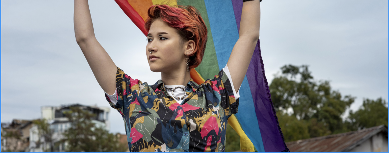 Woman holding a rainbow flag